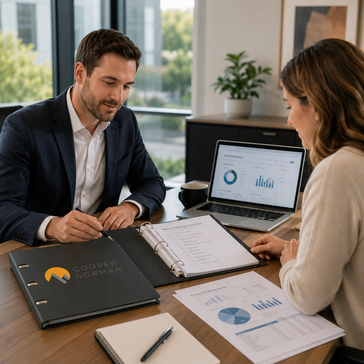 Cooper Norman Wealth advisor reviewing client portfolio in modern Idaho office.
