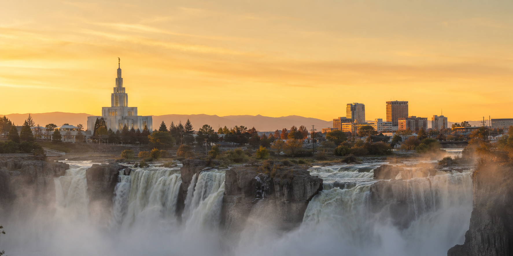 Idaho Falls waterfall and temple skyline at sunset.