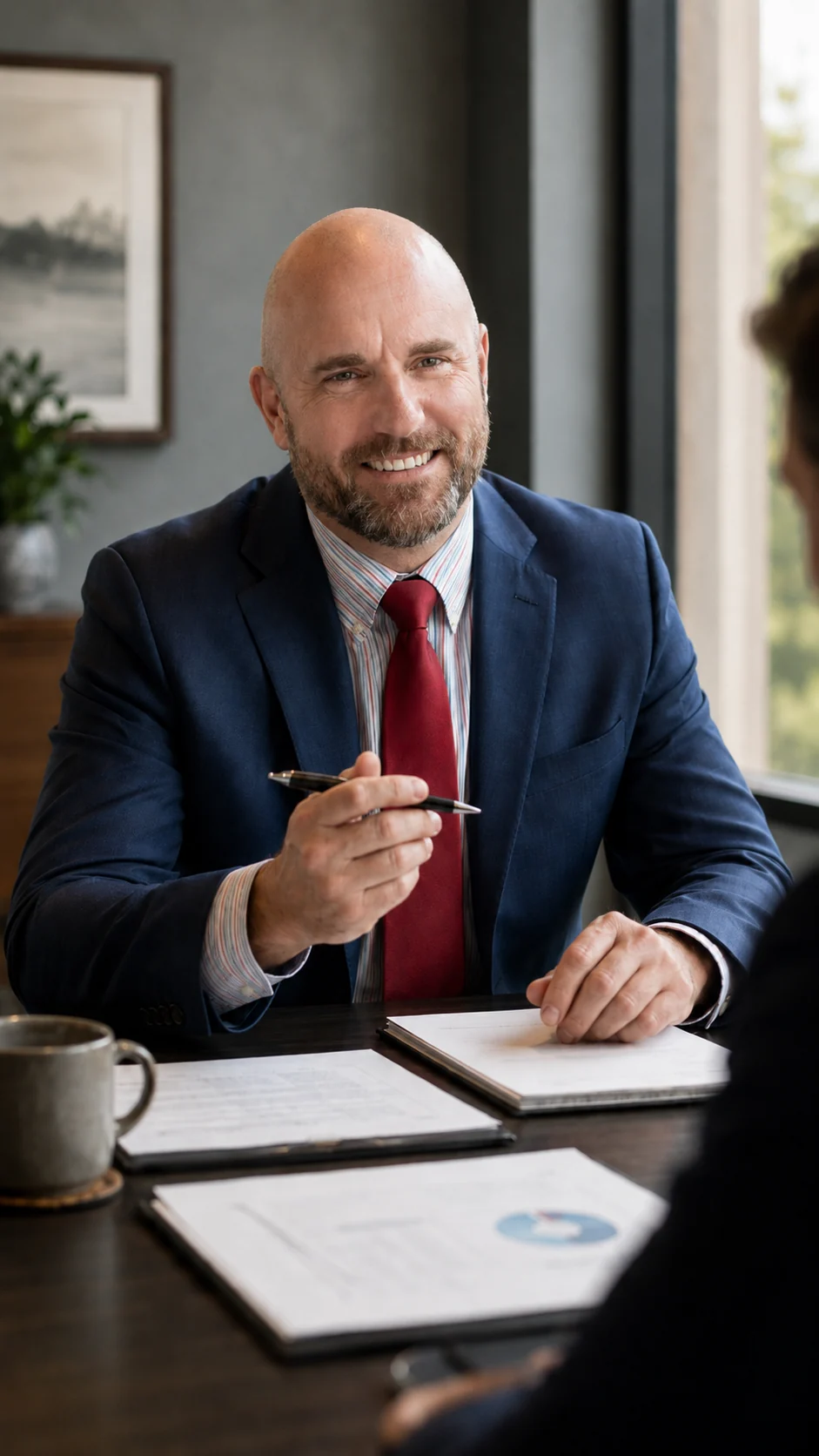 Nathan Rydalch, CLU, Wealth Advisor at Cooper Norman Wealth, in conversation with a client.